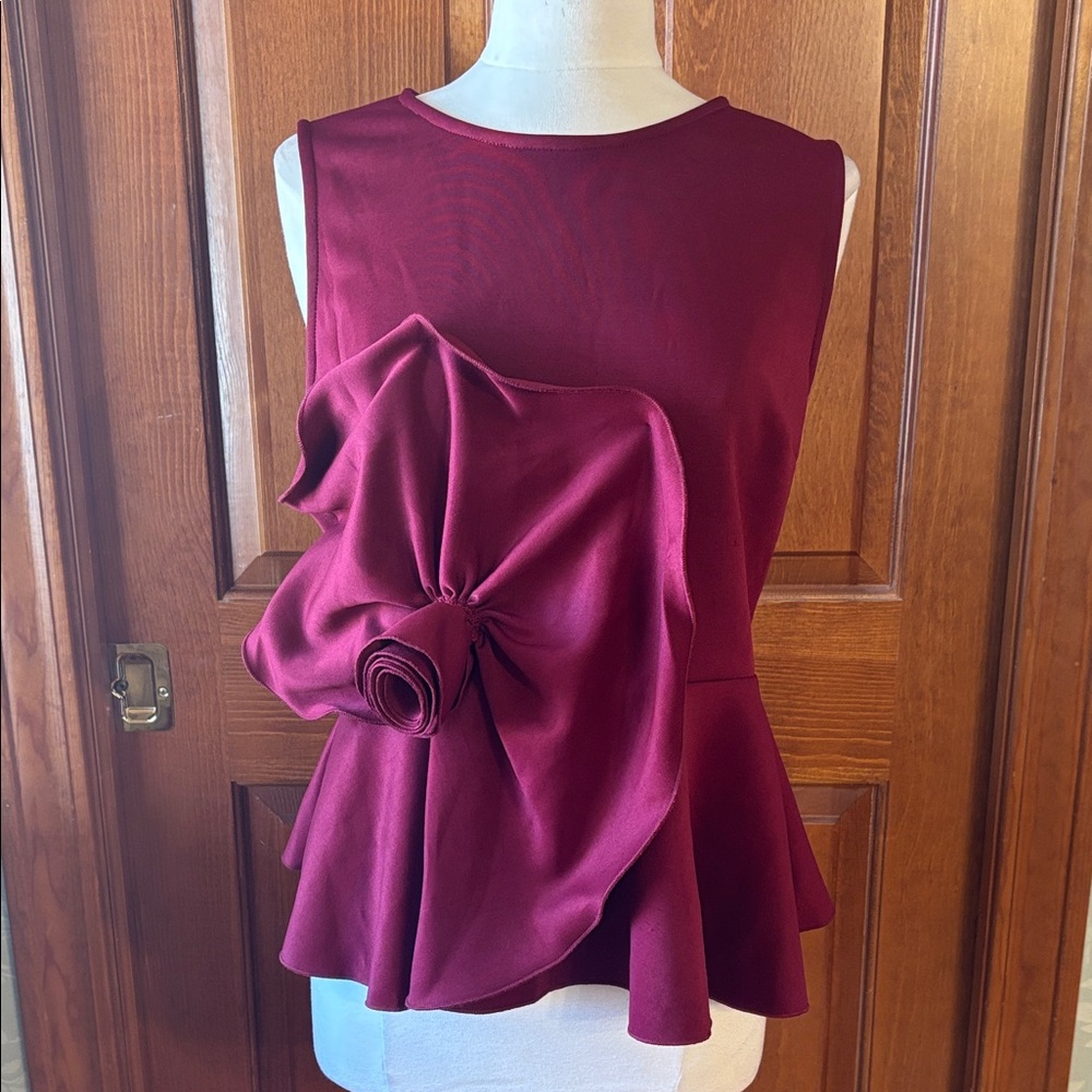 Chic Sleeveless Burgundy Peplum Blouse with Rose Detail. Women’s size large.